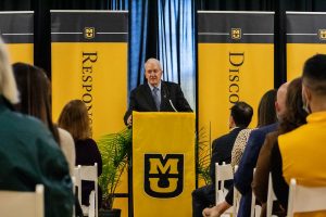 a photo of steve hanlon speaking at the announcement