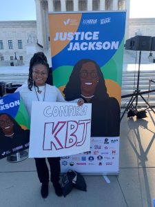 a photo of Niya Young in front of the supreme court building
