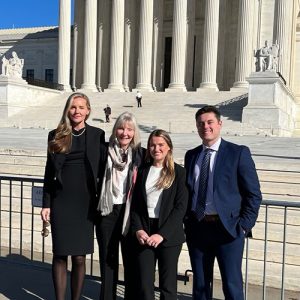 a photo of (right to left) Mizzou Law students Logan Tanner and Betsy Smith, professor emerita mary beck and her daugher, Joanna