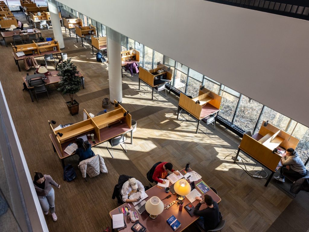 a photo of students studying in the library