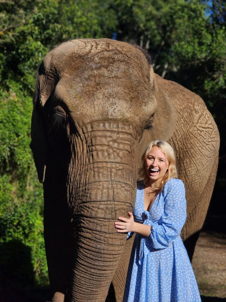 a photo of a woman with an elephant