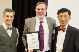 a photo of john lande with professor ilhyung lee and mizzou law graduate Brian Pappas
