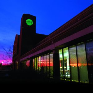 a photo of the outside of the law library at dusk