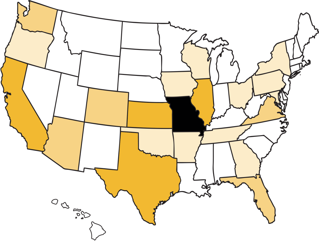 a photo of a US map with states color coded black or gold for number of alumni