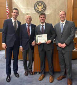 austin siener, luke nutwell and eric siemens with judge doug ginsberg