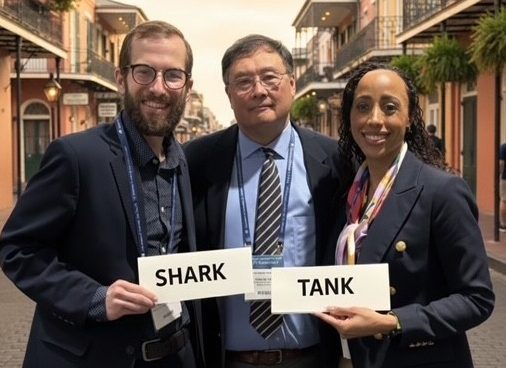 renee henson with two professors in new orleans holding a sign saying shark tank