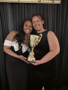 students hold third place trophy