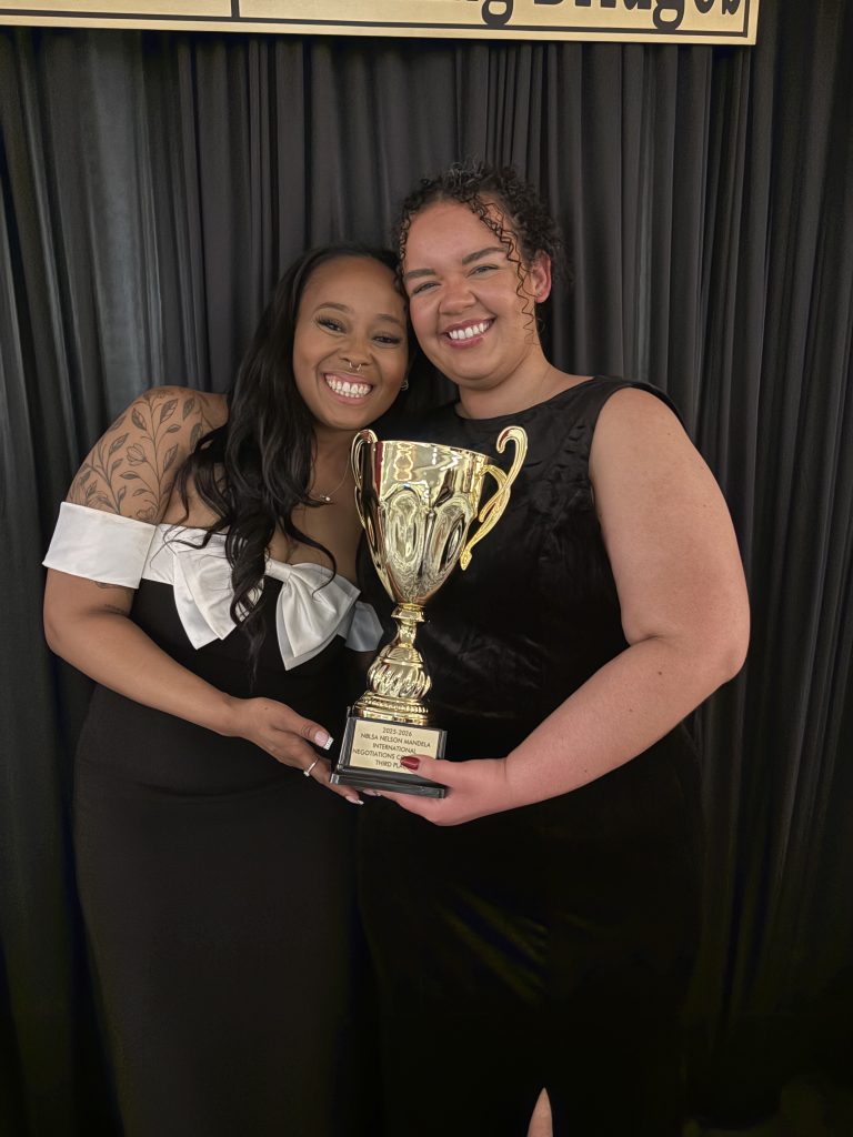 students hold third place trophy