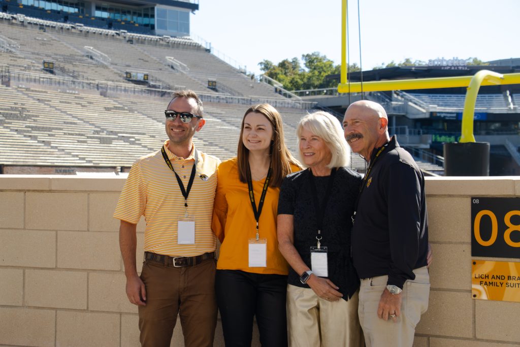 alumni at the football stadium